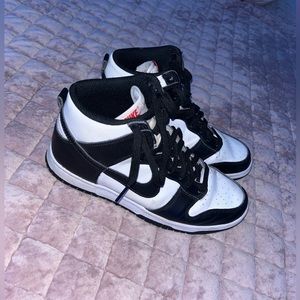 Black and white Nike dunks, a bit worn